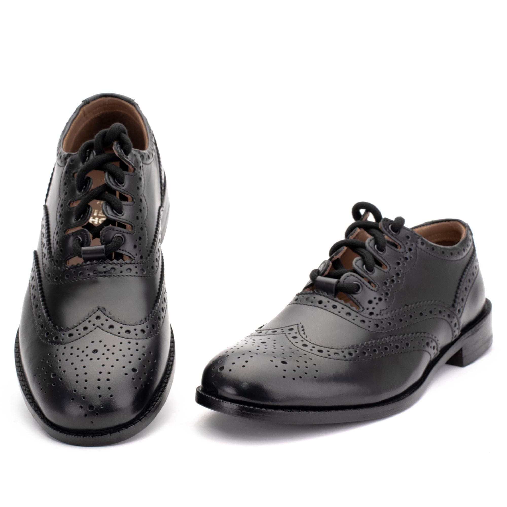 Traditional black leather ghillie brogue with perforated brogue detailing, long wraparound laces, and a steel quarter tip heel.