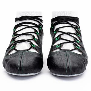 Black leather Glenshee green Highland dance pumps with green stitching, 4-finger lace system, front seam with loop, extra ankle eyelet, shock-absorbing insoles, and flexible chrome suede sole.