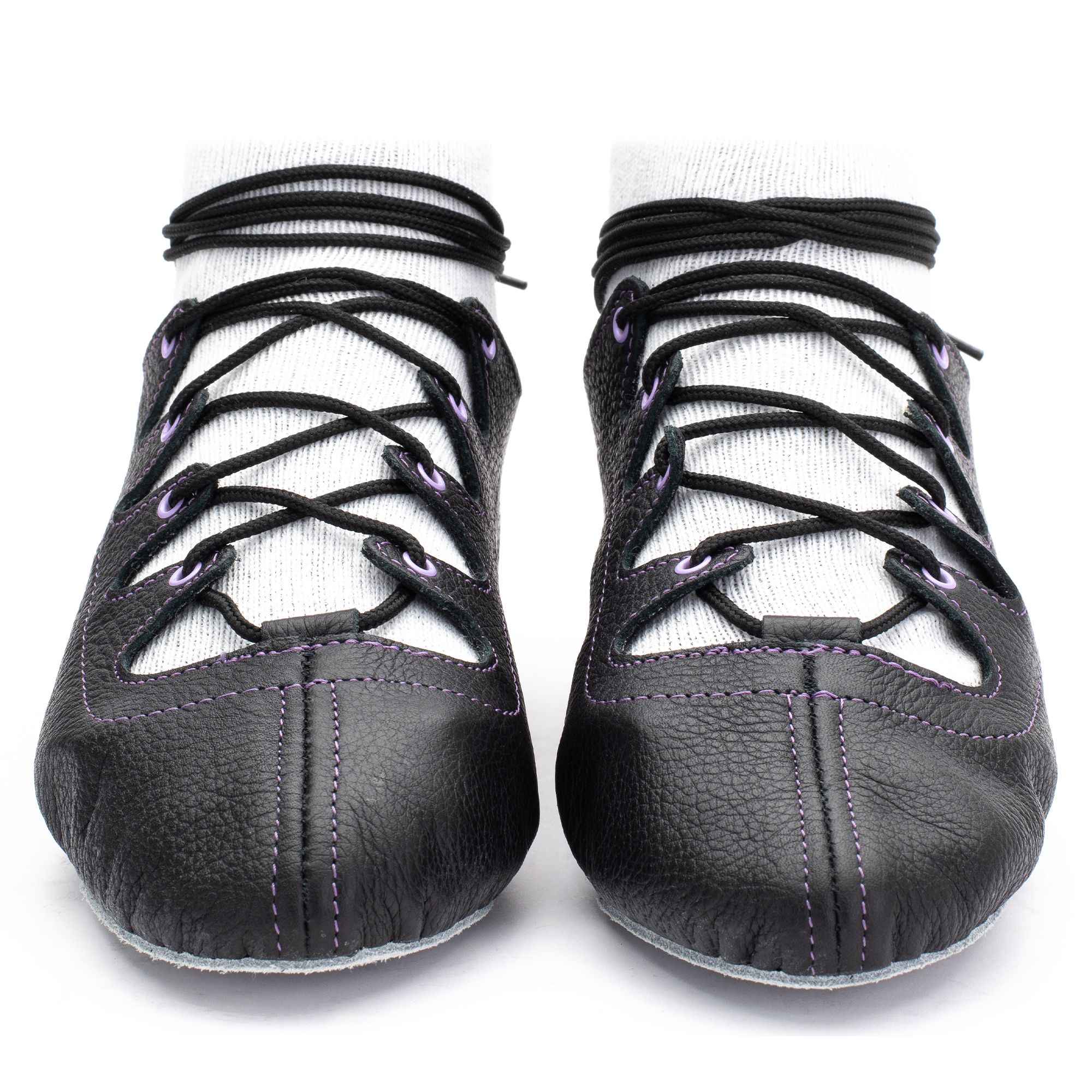 Black leather Glenshee Purple Highland dance pumps with purple stitching, 4-finger lace system, front seam with loop, extra ankle eyelet, shock-absorbing insoles, and flexible chrome suede sole.