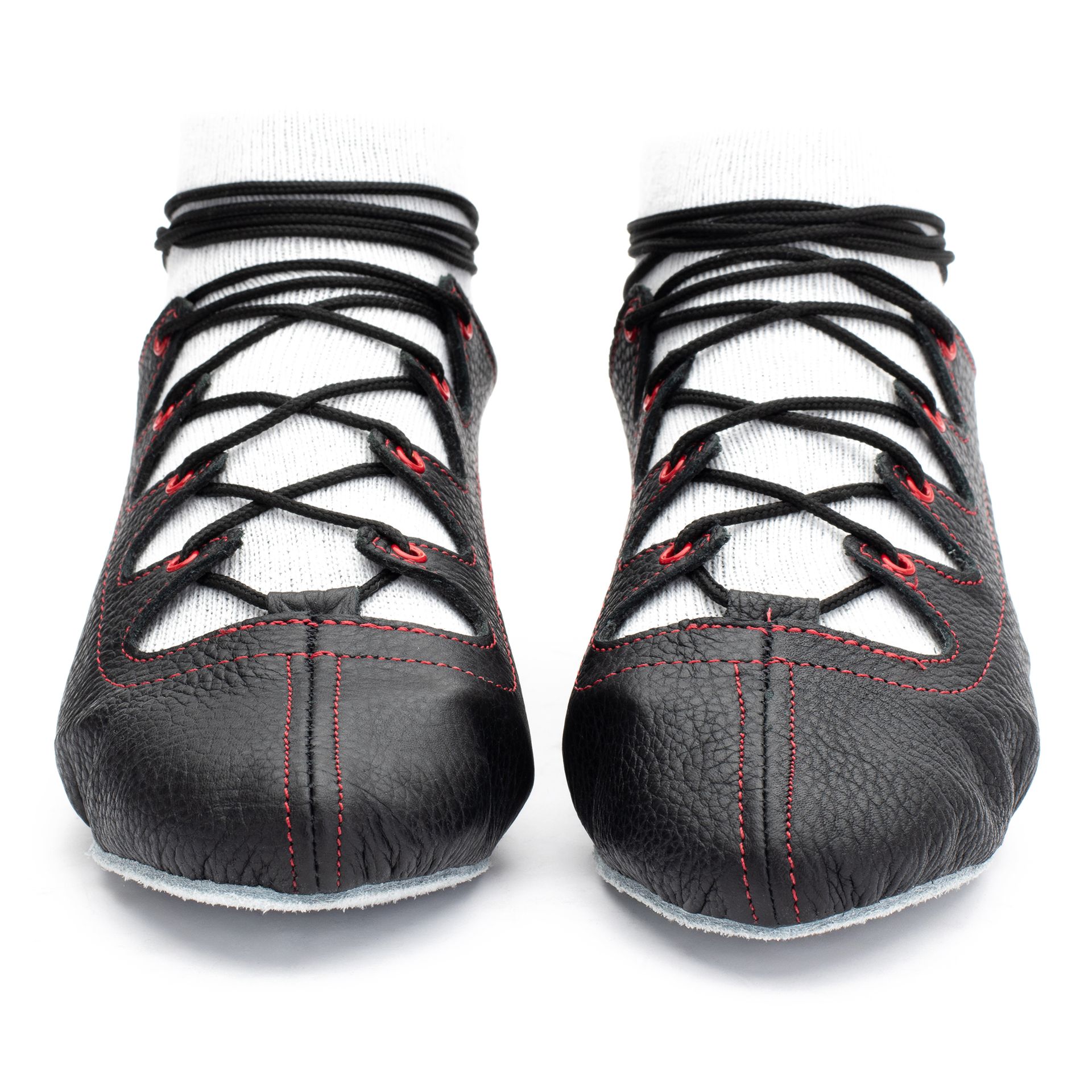 Black leather Glenshee Red Highland dance pumps with red stitching, 4-finger lace system, front seam and loop, extra ankle eyelet, and flexible chrome suede sole